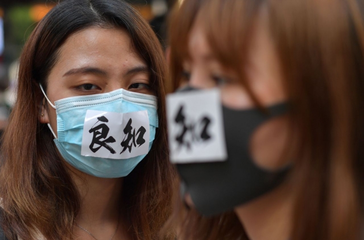 Hong Kong leader bans masks in hardening stance on protests