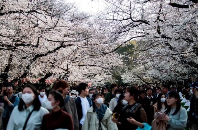 'Joy of spring': Japan fetes cherry blossoms despite virus