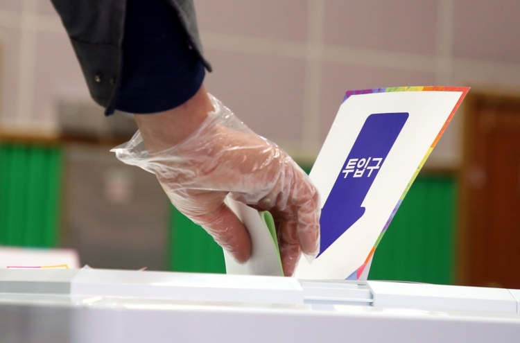S. Koreans vote amid coronavirus outbreak with higher turnout than before