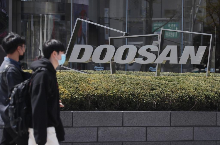 Doosan to raise W1tr by selling shares, assets