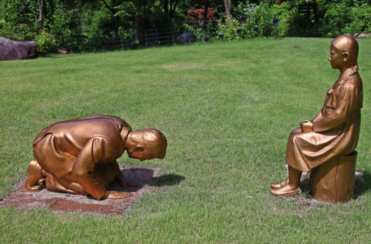 Kneeling man’s statue stirs controversy in Seoul, Tokyo