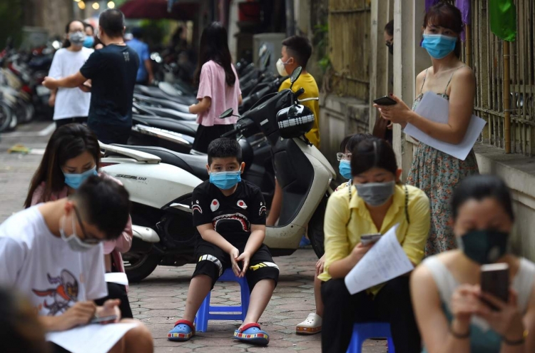 Vietnam reports 1st ever virus death after renewed outbreak