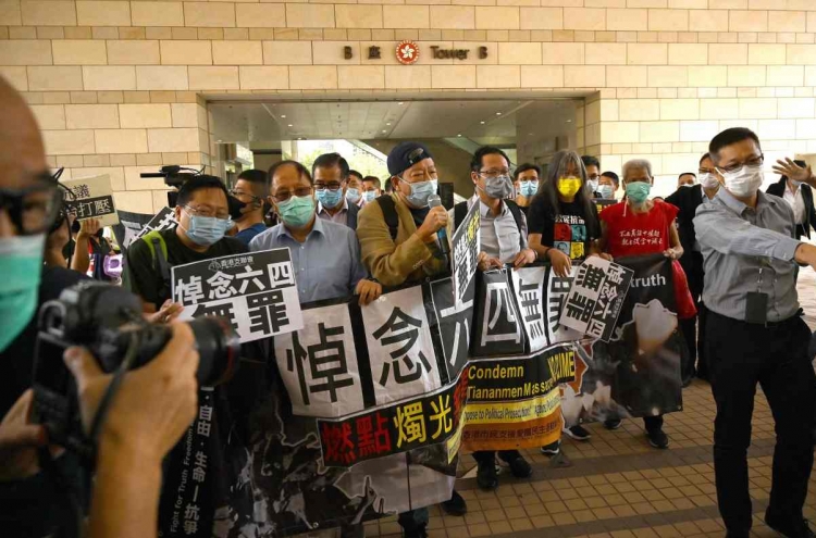 Hong Kong pro-democracy lawmakers threaten mass resignation