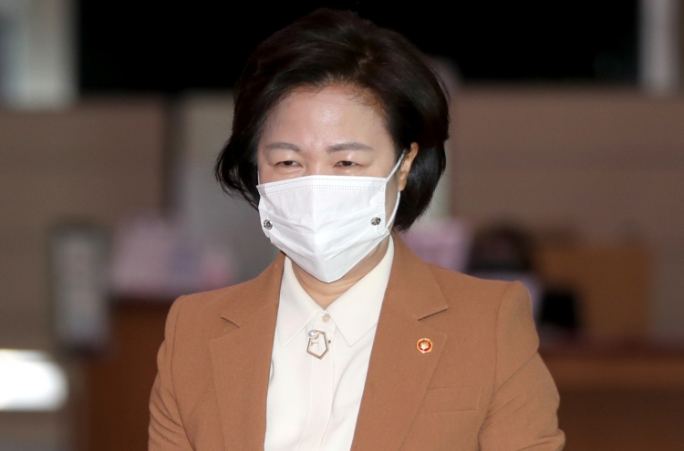 Justice minister apologizes over massive virus outbreak at detention center