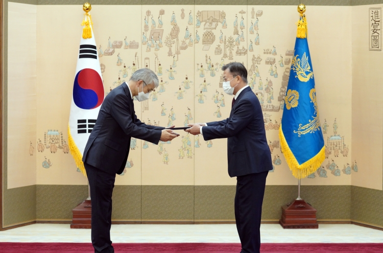 Moon presents new Supreme Court justice with letter of appointment