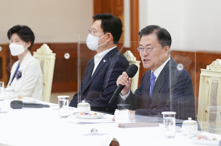 Moon seeks close teamwork with ruling party in his final year in office