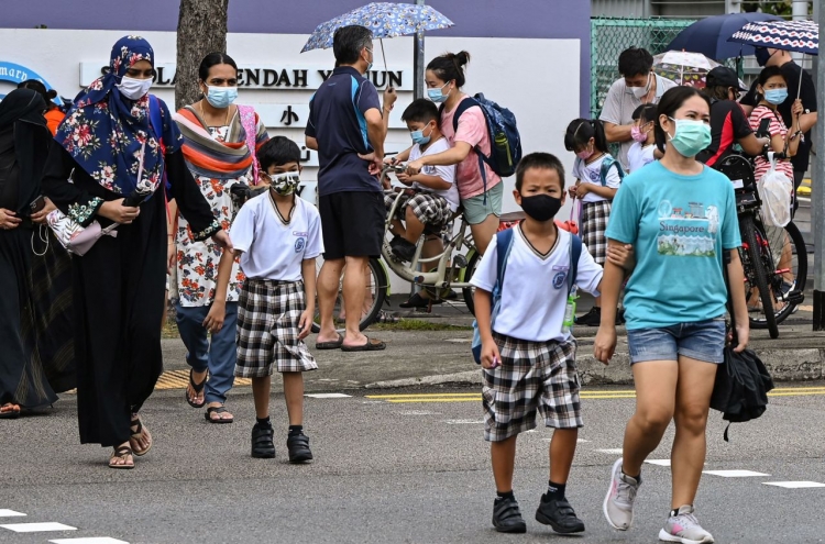 Singapore shuts schools, Taiwan bars foreigners to battle outbreaks