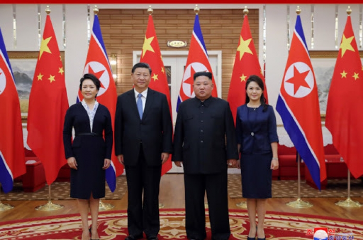 Kim and Xi highlight strong relations on treaty-signing anniversary