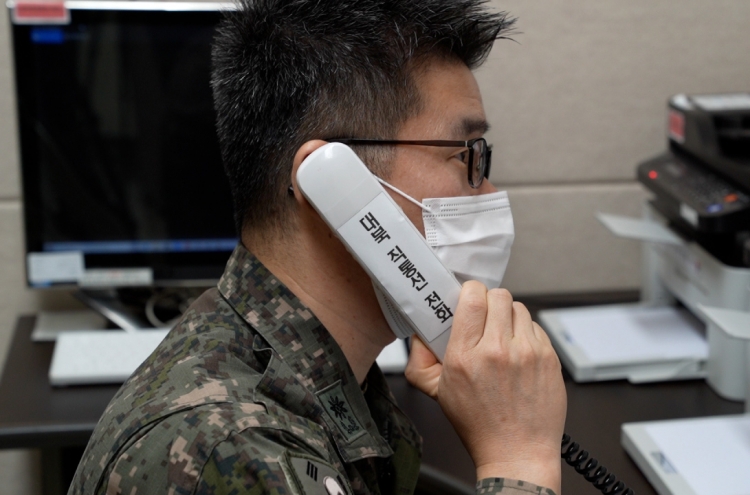 Two Koreas hold daily liaison, military calls after restoring communication lines