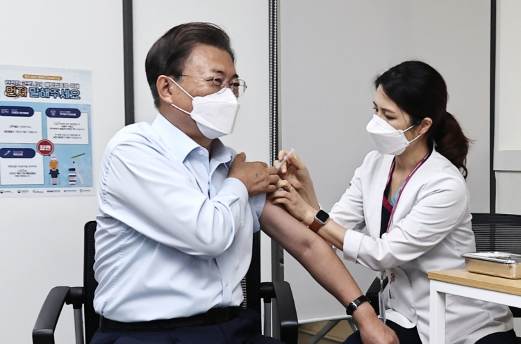 President Moon, first lady receive COVID-19 booster shots
