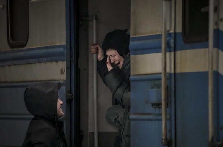 Russia strikes near Ukrainian capital; port city under siege