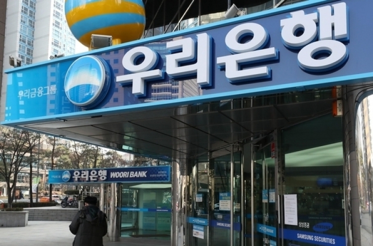 Woori Bank employee turns himself in after embezzling W50b of company funds: police
