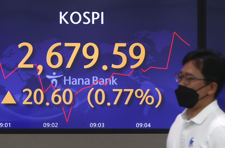 Seoul shares open higher on hopes of easing inflation
