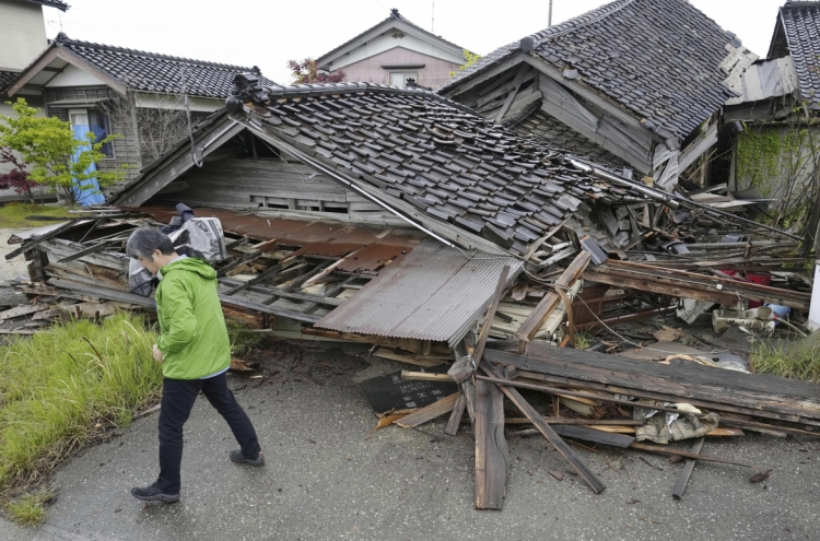 Aftershocks shake Japan after quake kills one, destroys homes