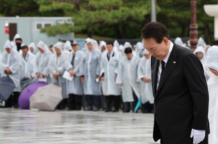 Yoon hails democracy heroes, makes plea for national unity