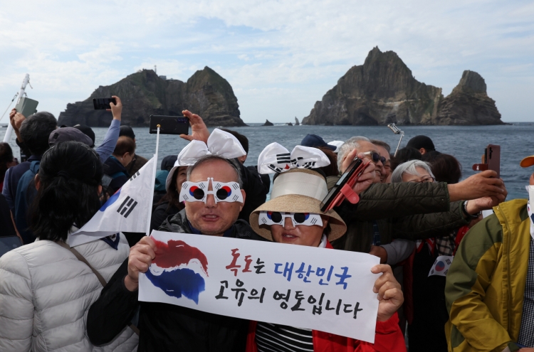 Braving wind and high water to celebrate Dokdo Day