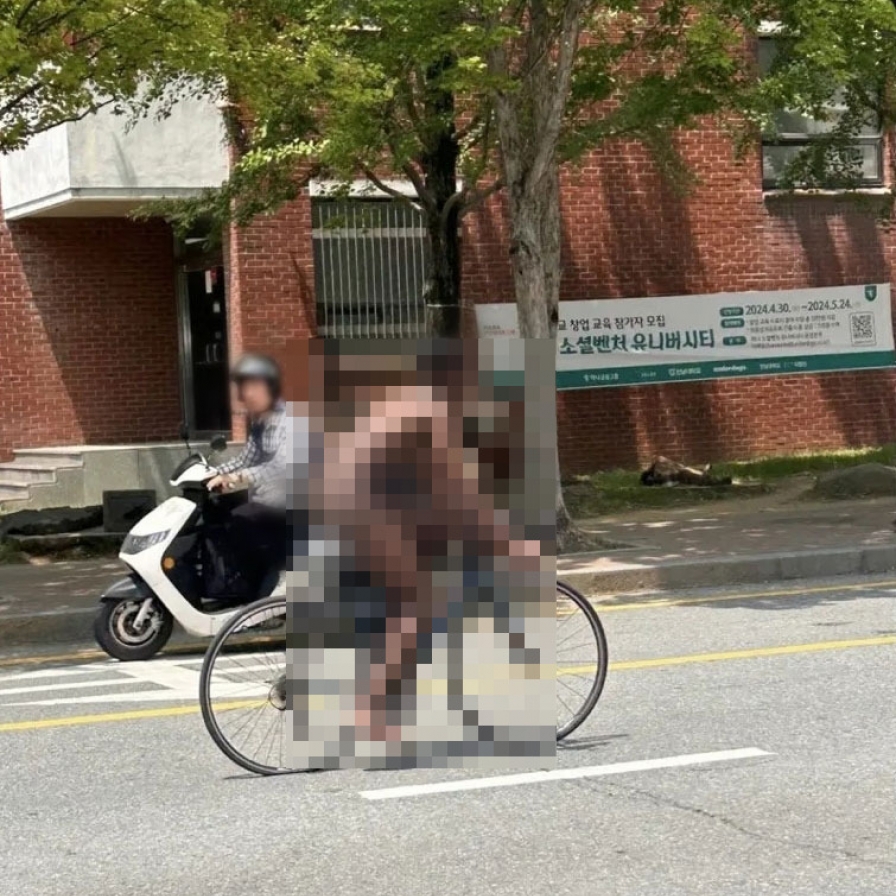 Student nabbed for biking naked 'due to stress'