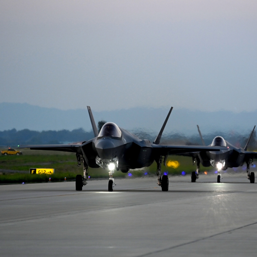 South Korea flies fighters near border over North Korean spy satellite alarm