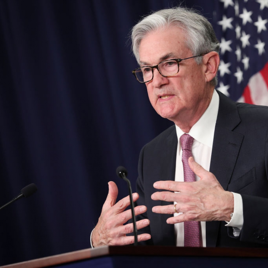 Fed freezes key interest rate, forecasts one rate cut this year