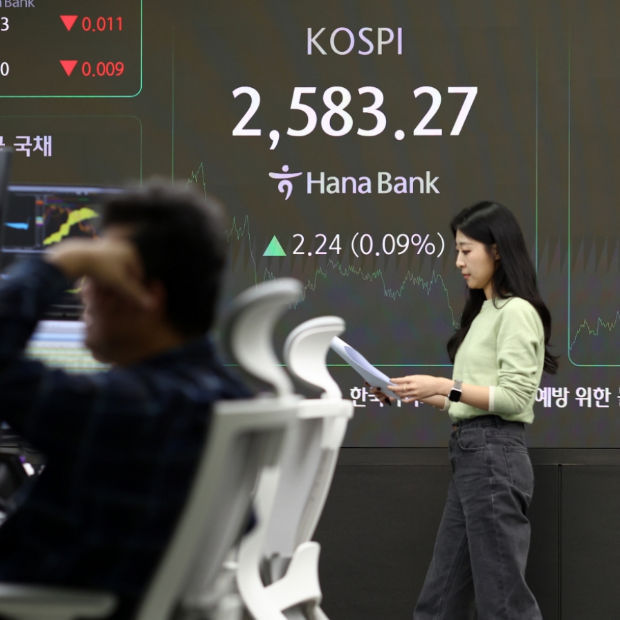 Seoul shares end tad higher; won at nearly 4-month low