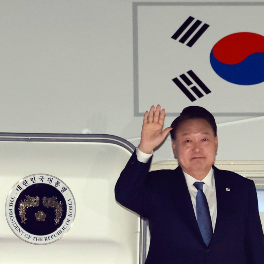 Yoon returns home from APEC, G20 summits