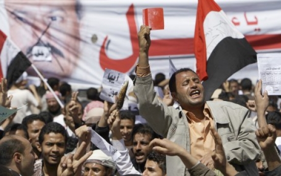 Yemeni president digs in as protests spread