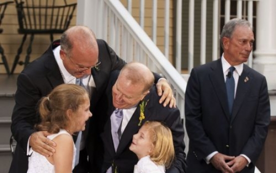 Couples wed on first day gay marriage is legal in New York