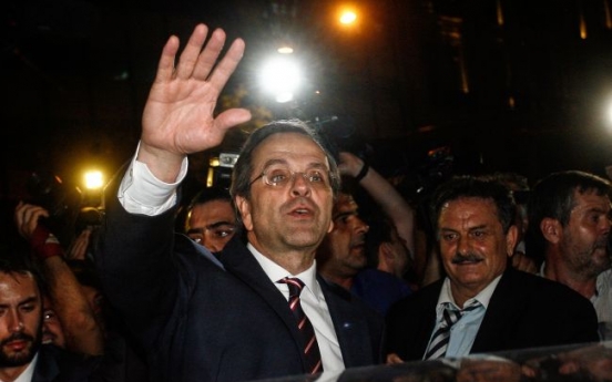 Greek conservatives win, head into coalition talks