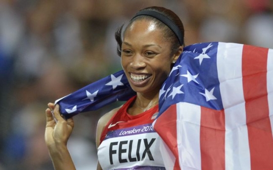 Third time lucky as Felix wins women's 200m gold