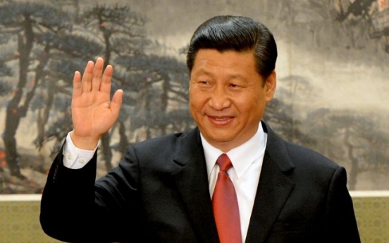 Xi takes helm amid reform calls