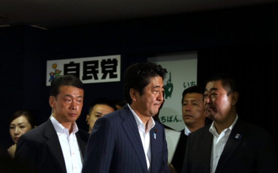 Japan's ruling bloc wins upper house elections