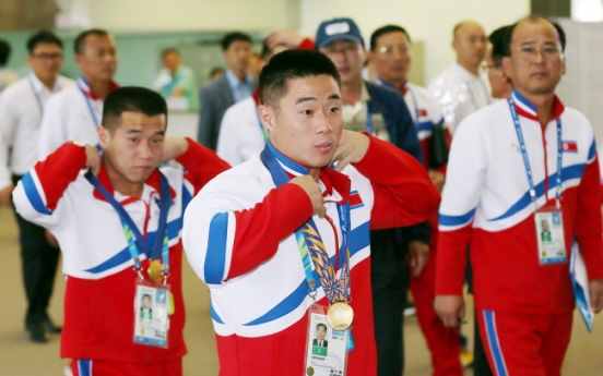 [Asian Games] N. Korean lifters dedicate victories to young leader