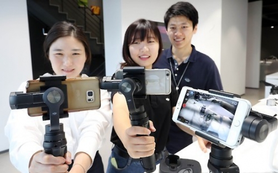 DJI unveils 3-axis handheld stabilizer for phone camera