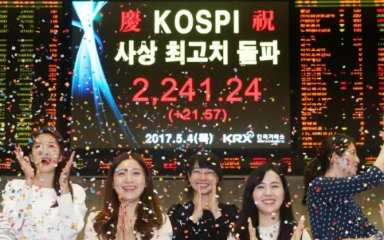 Kospi hits record-high, offsets strong dollar