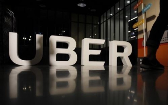 Uber, KB Financial team up for food delivery service in Korea