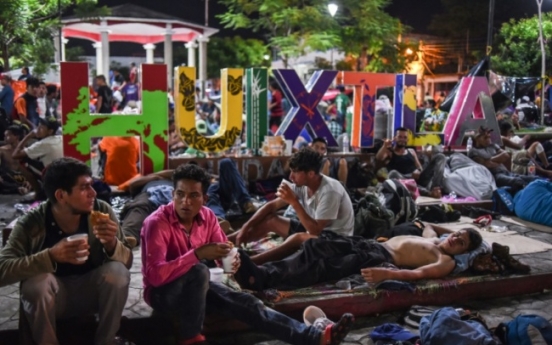 Migrant caravan stops to rest in Mexico amid Trump threats