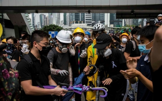 [Newsmaker] Protesters control key roads after historic Hong Kong rally