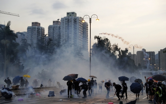 Hong Kong unrest spreads as leader warns city on brink