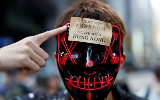 To ban or not to ban? Masked protesters in other countries