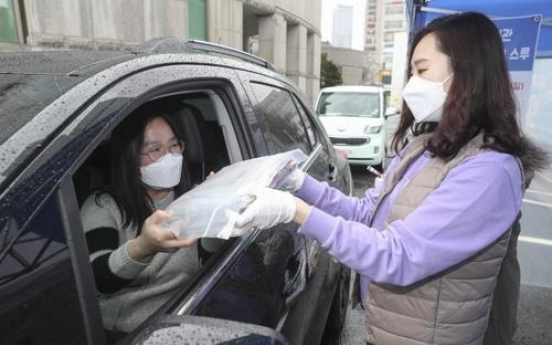 Local libraries provide drive-thru service as coronavirus spreads