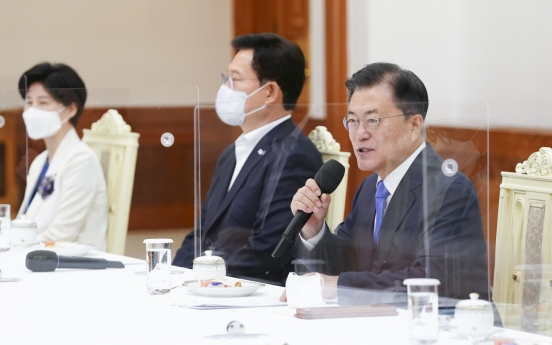 Moon seeks close teamwork with ruling party in his final year in office