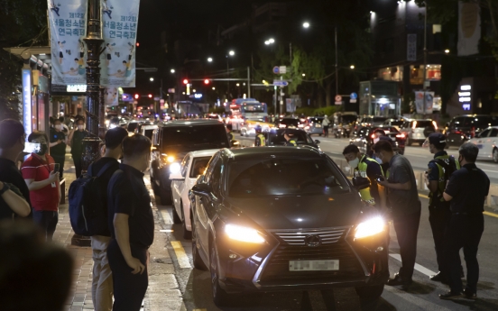 Hundreds of merchants hold late night drive-through rally against COVID-19 restrictions