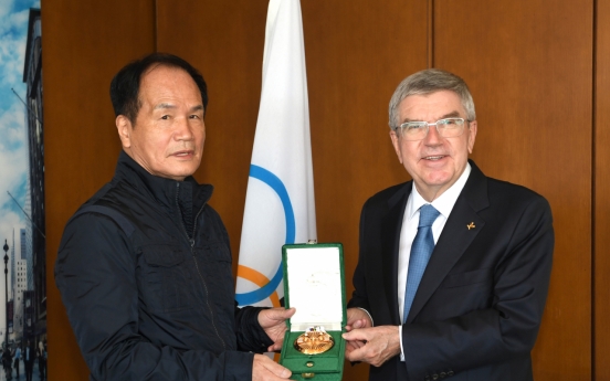 In a first for Korea, sports photographer Kim Min-jae receives Pierre de Coubertin medal