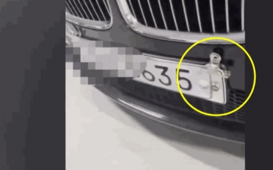 Car owner uses fake license plate, possibly to dodge parking fees