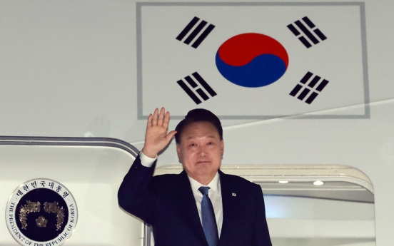 Yoon returns home from APEC, G20 summits