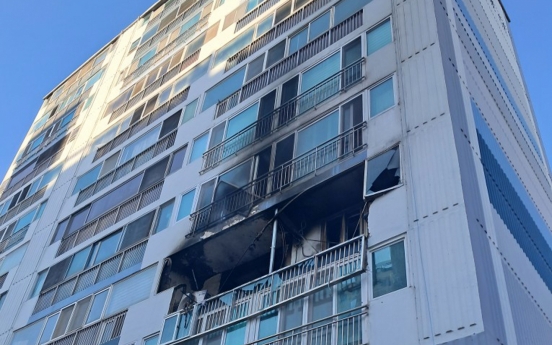 Two butane gas explosions start fires in apartments, killing one