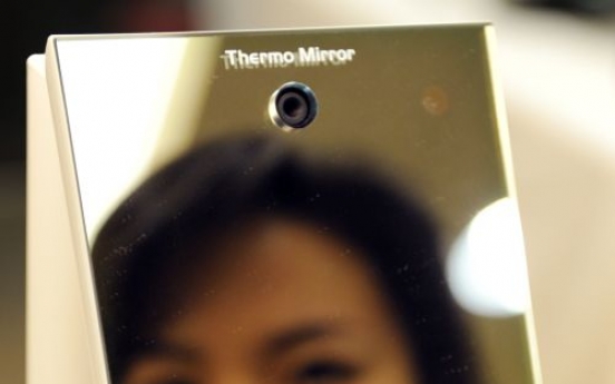 Japanese firm invents mirror to spot the flu