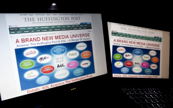 AOL steps up news, ad push with Huffington Post