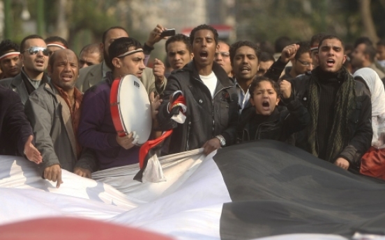 Egypt regime warns of crackdown as revolt spreads