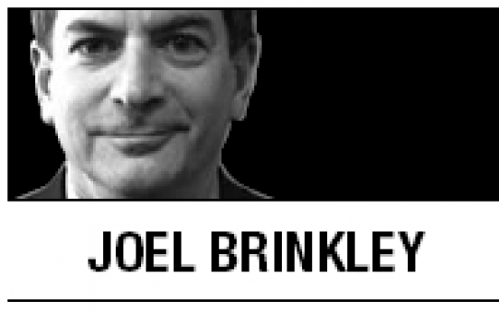 [Joel Brinkley] A temple and a tempest at the border